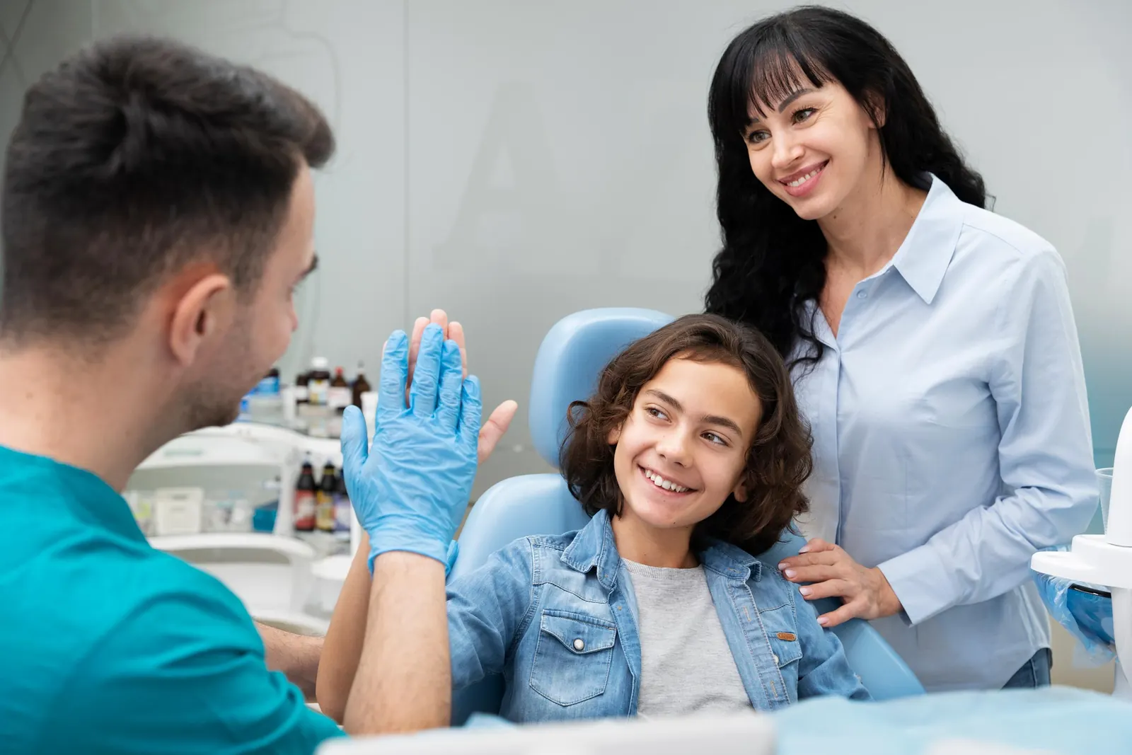 Smiling patient with her family at a South Dental office